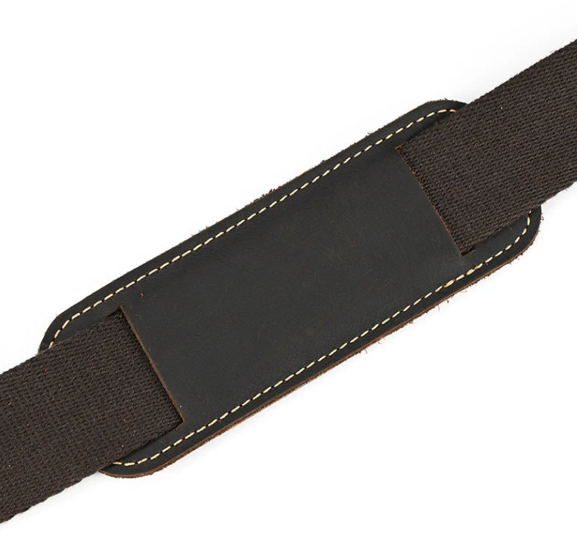 Detail of a leather and fabric strap with stitching, ideal for enhancing a stylish leather rucksack.