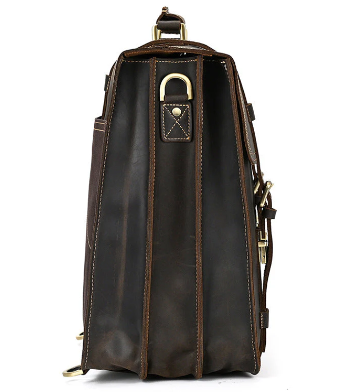 Side view of a stylish leather rucksack in brown, showcasing its spacious interior and durable design.
