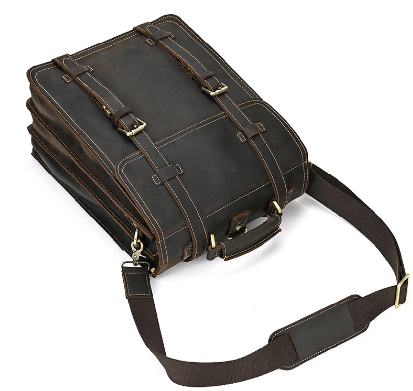 Stylish leather rucksack in dark brown with adjustable straps, perfect for travel and everyday use.