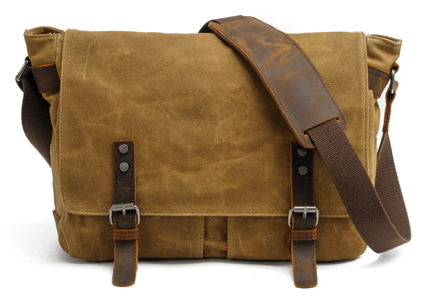 Retro shoulder bag in brown canvas with stylish leather accents and adjustable strap, perfect for everyday use.