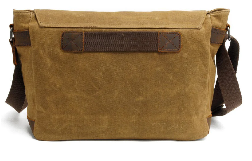 Retro shoulder bag in brown canvas with adjustable strap and leather accents, ideal for stylish everyday use.