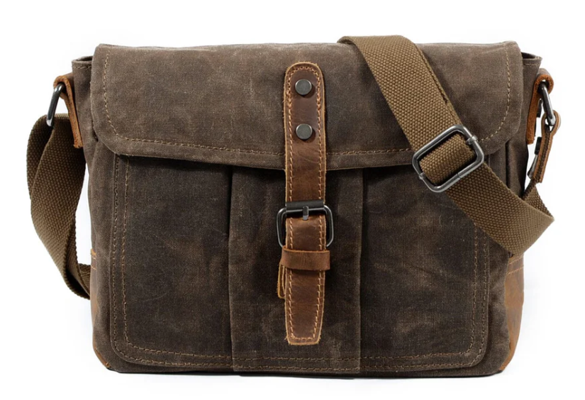 Small Canvas Messenger Bag in dark brown with adjustable strap and front pockets, perfect for daily use.