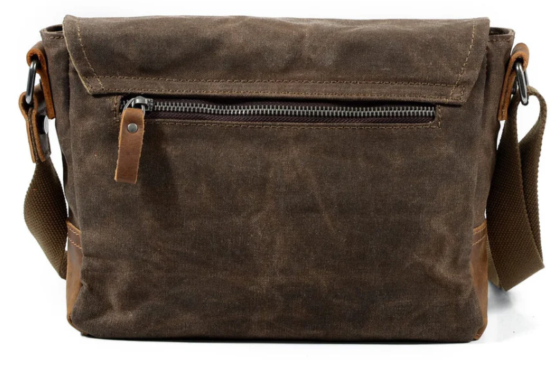 Small canvas messenger bag in dark brown with zipper pocket, perfect for everyday use, by Pyrenees.