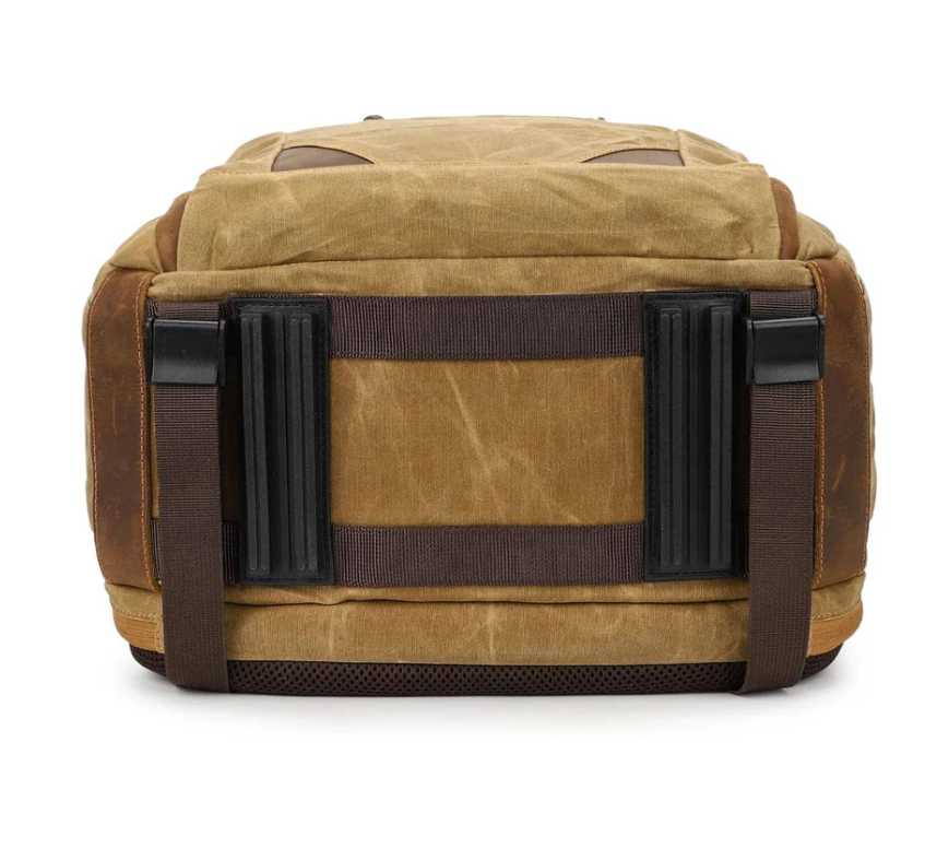 Back view of a vintage camera backpack featuring a rugged design and sturdy straps, perfect for photographers on the go.