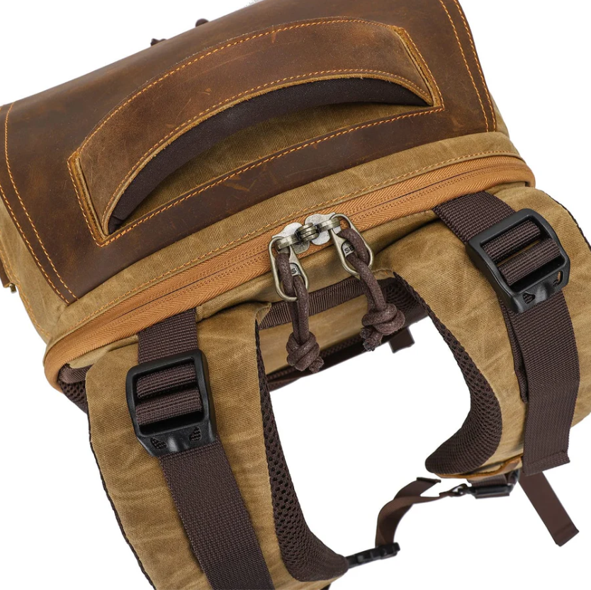 Vintage camera backpack top view, featuring brown leather and durable straps for outdoor photography gear.