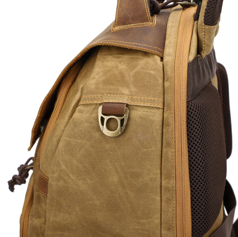 Side view of the vintage camera backpack with a rugged design and leather accents, perfect for outdoor photographers in Sierra Nevada.