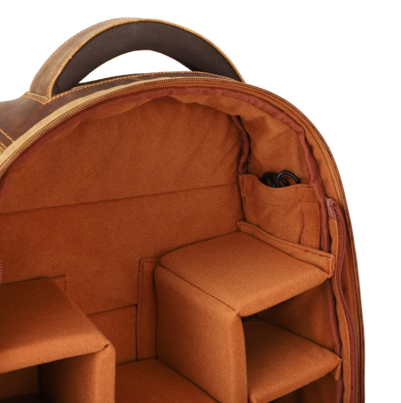 Interior view of a Vintage Camera Backpack showcasing padded compartments for camera gear