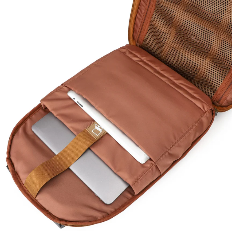 Vintage camera backpack interior showing padded laptop compartment with secure strap.
