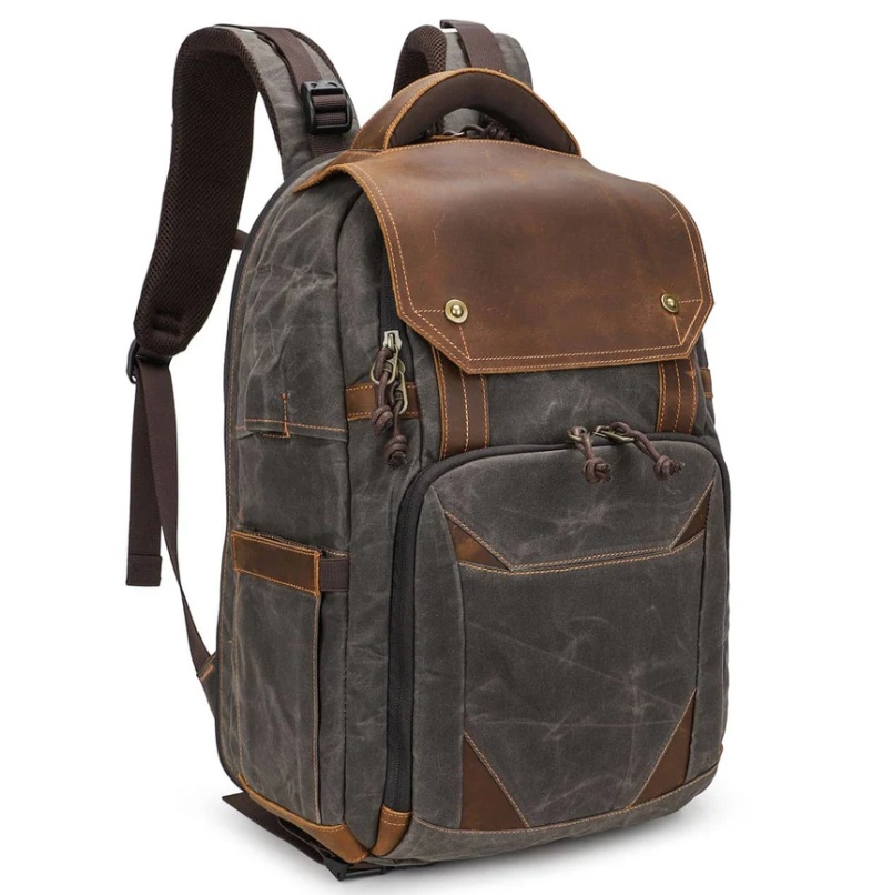 Vintage camera backpack in gray and brown leather, designed for outdoor photography adventures.