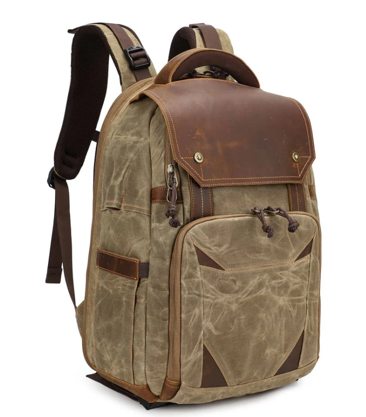 Vintage camera backpack in khaki with leather accents for photographers, perfect for outdoor adventures.