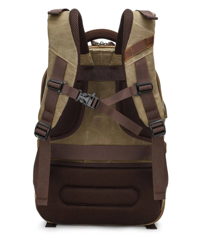Vintage camera backpack from Sierra Nevada, featuring adjustable straps and a durable canvas design.