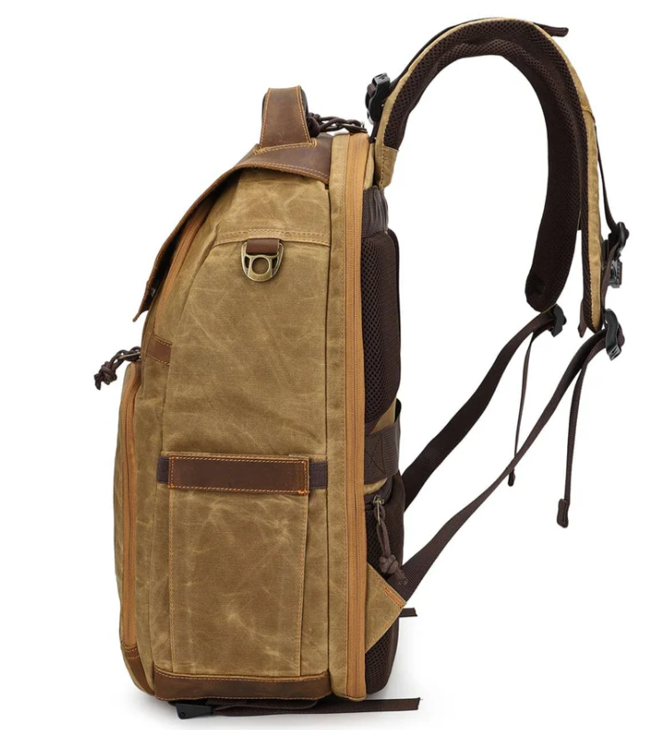 Vintage Sierra Nevada camera backpack in brown canvas, showcasing side view, sturdy design with multiple pockets.