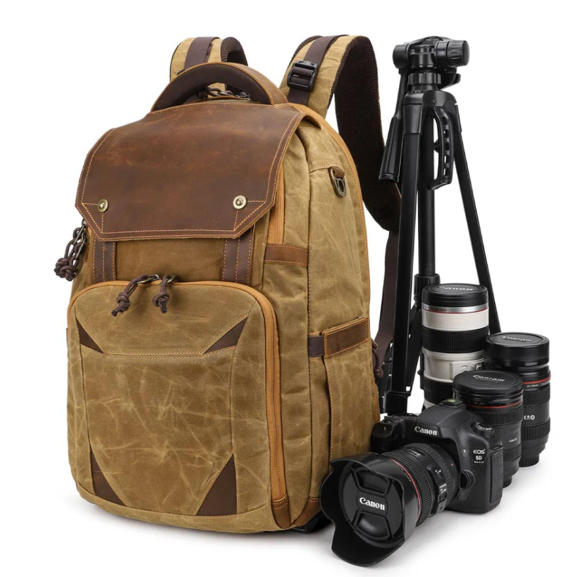 Vintage camera backpack by Sierra Nevada, featuring durable fabric, brown leather accents, and space for camera gear.