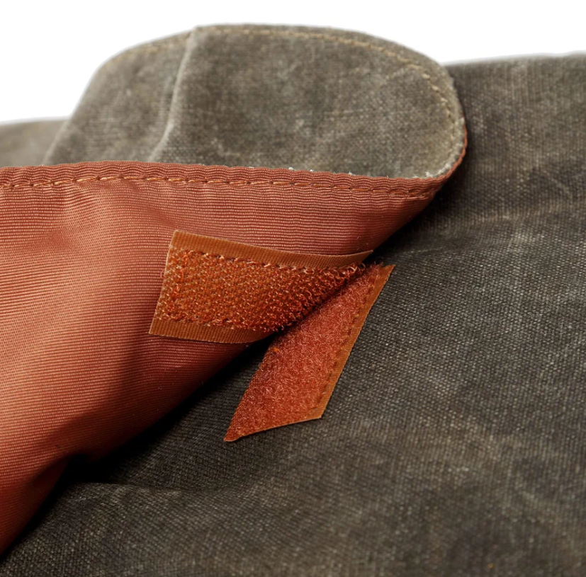 Close-up of waterproof canvas detail with velcro fastening inside the Antarctica camera backpack.