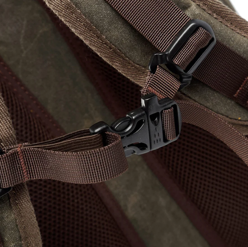 Close-up of the adjustable buckle on the Waterproof Canvas Camera Backpack, showcasing its durable design.