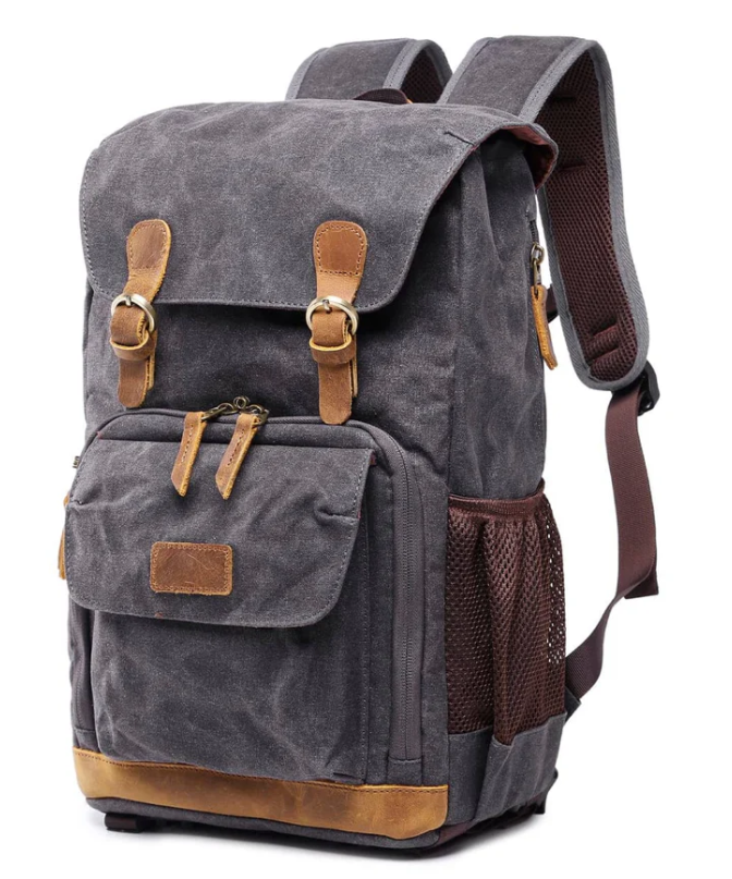 Waterproof canvas camera backpack in gray with brown accents, perfect for outdoor photography adventures.