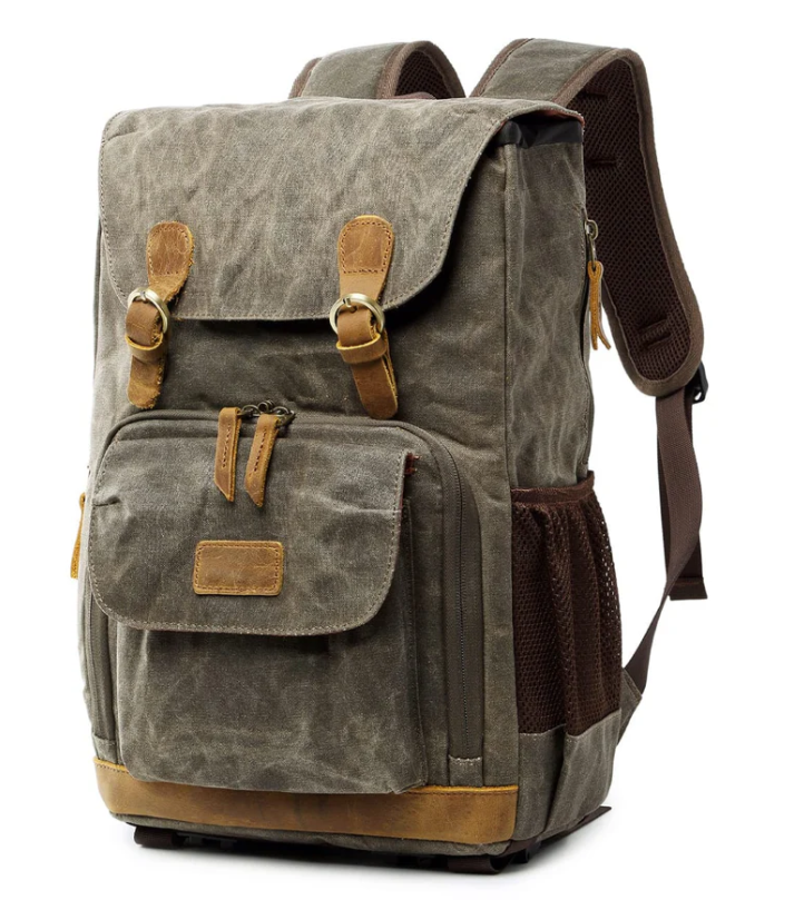 Waterproof canvas camera backpack in gray with leather accents, ideal for outdoor photography adventures