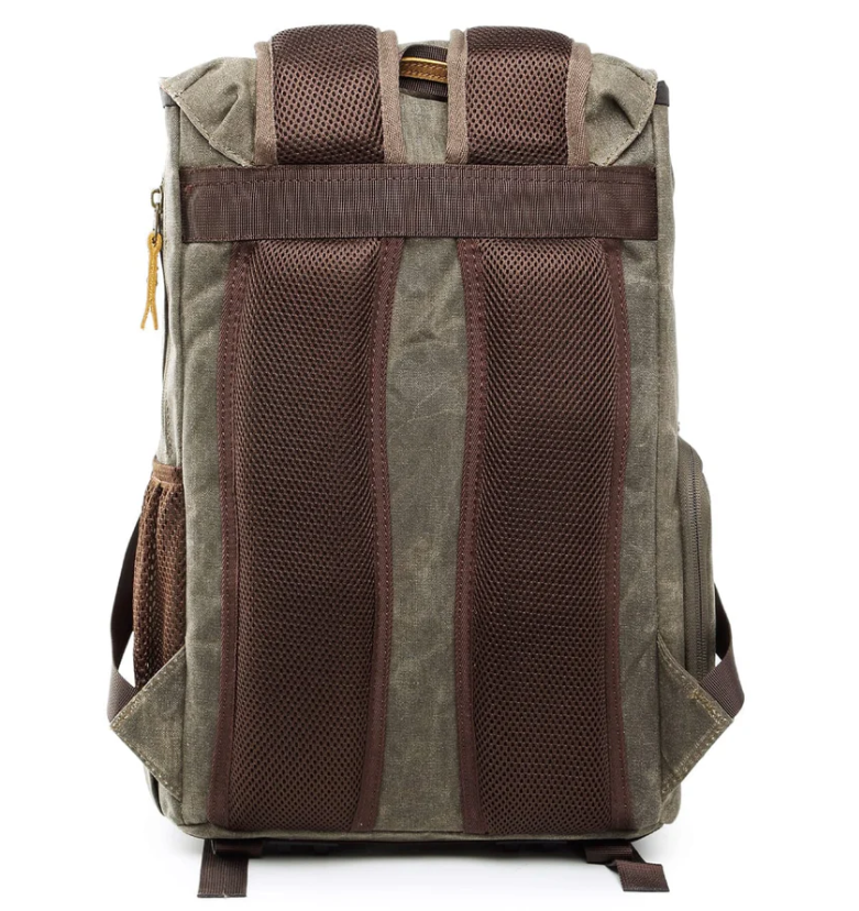 Waterproof canvas camera backpack in olive green with padded shoulder straps and mesh back for ventilation.