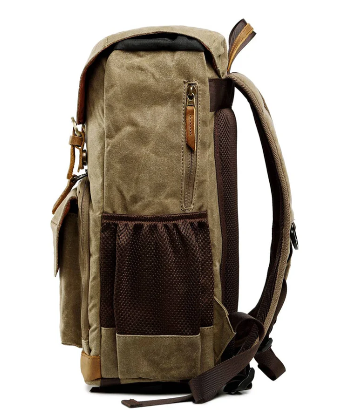 Waterproof canvas camera backpack in brown with mesh side pocket, ideal for outdoor photography adventures.
