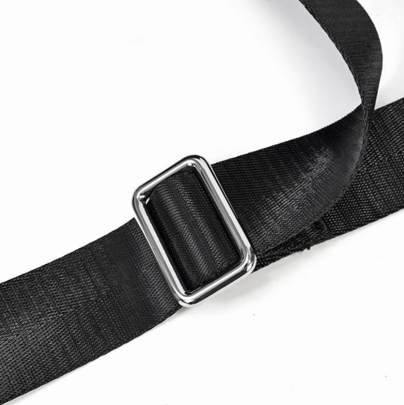 Close-up of a black nylon strap with a silver metal buckle detail, showcasing durability and style.