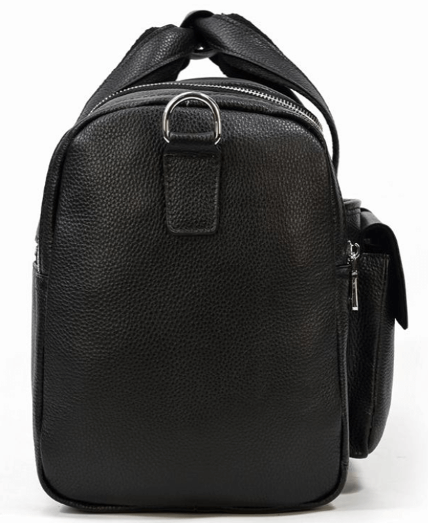 Black leather duffle bag with textured finish, featuring sturdy zippers and adjustable strap, perfect for stylish travel.