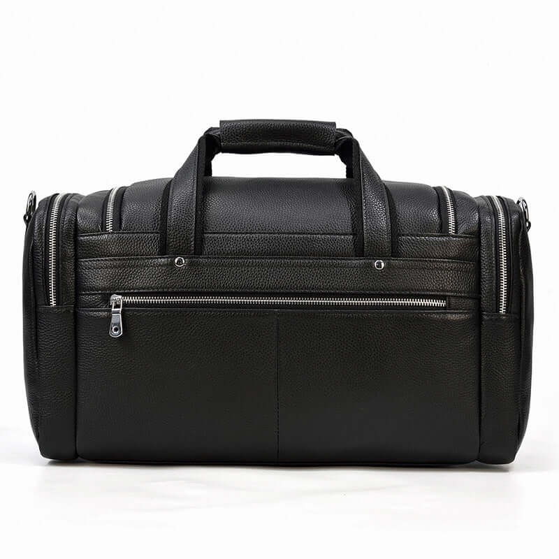 Stylish black leather duffle bag with dual zippers and sturdy handles, perfect for travel and daily use.