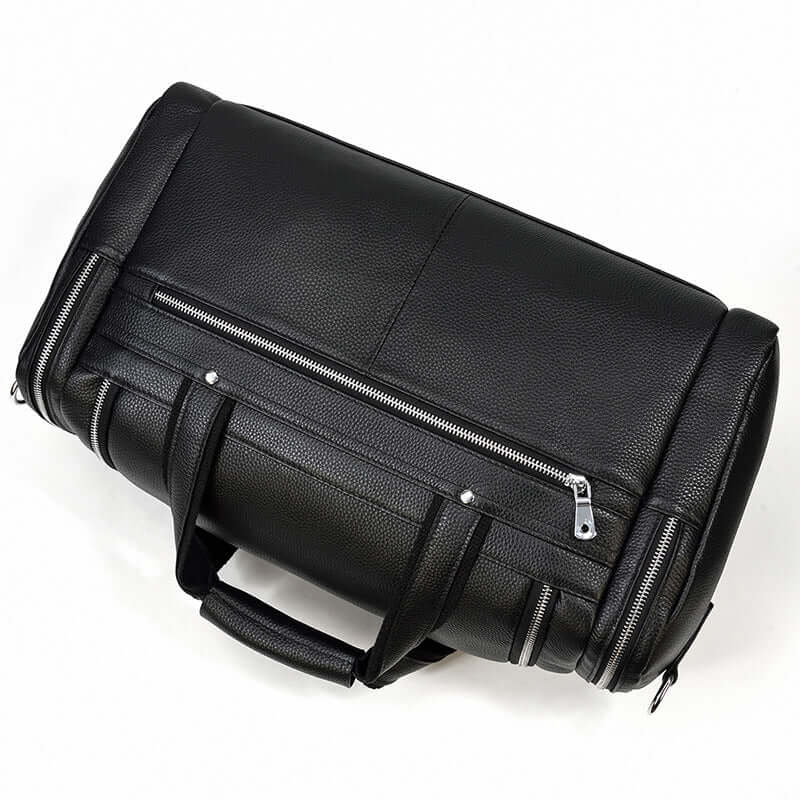Black leather duffle bag with zippers, perfect for stylish travel or weekend getaways.