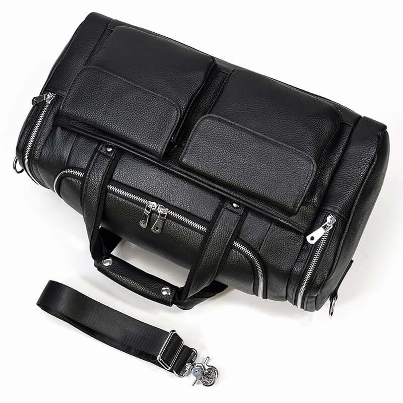 Black leather duffle bag with dual front pockets and adjustable strap, perfect for travel and outdoor adventures.