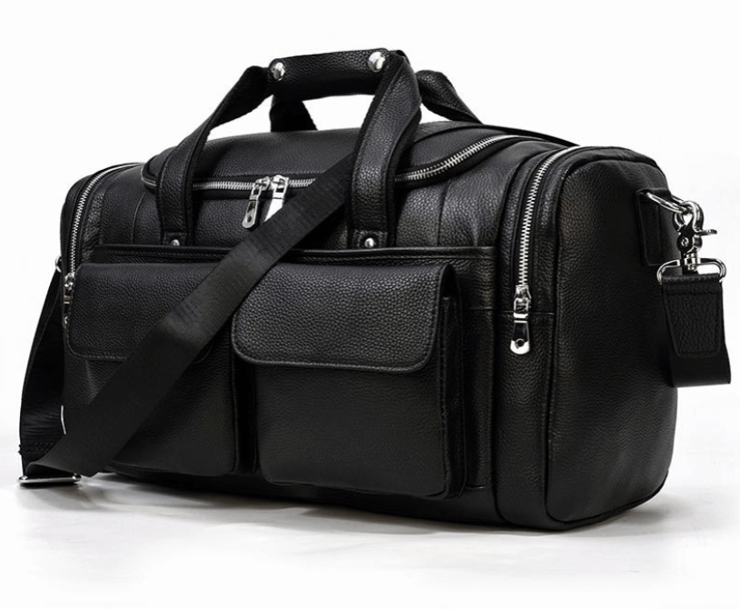 Stylish black leather duffle bag with pockets and shoulder strap, perfect for travel and adventure. Norwegian Fjords collection.