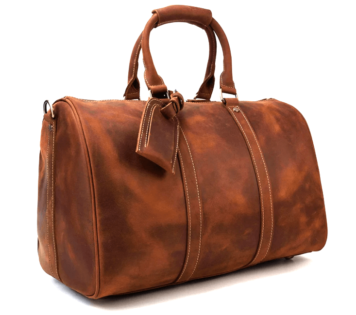 Handcrafted leather duffle bag in warm brown with sturdy handles, perfect for travel and adventure.