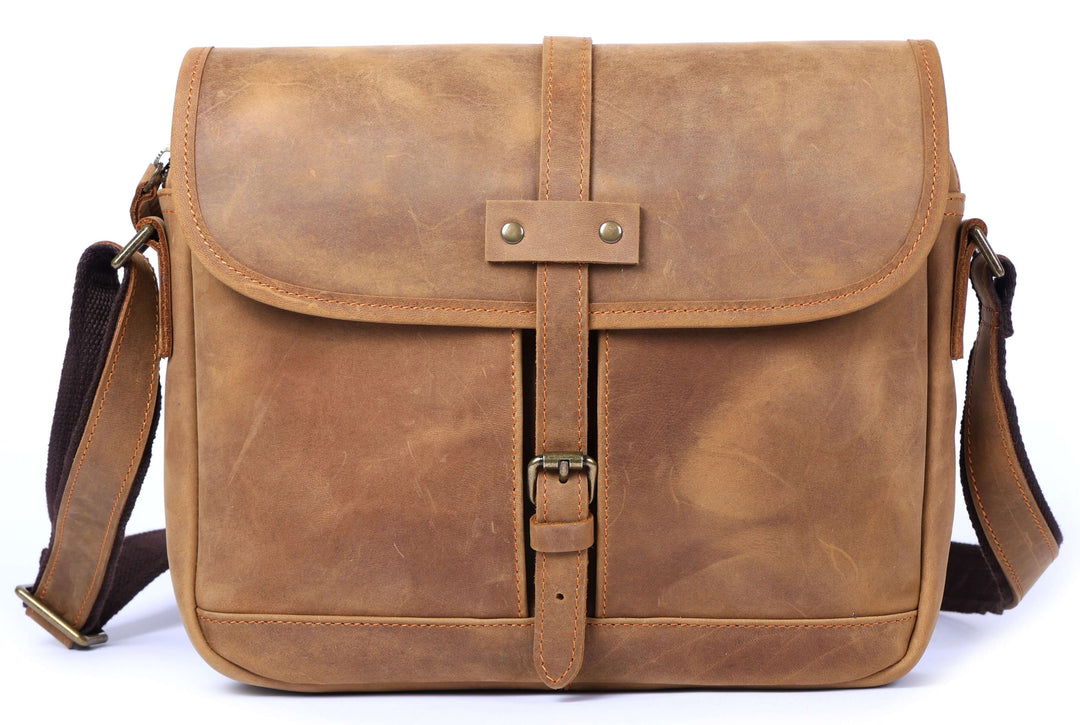 Vintage leather messenger bag with a buckle and adjustable strap, perfect for style and practicality.